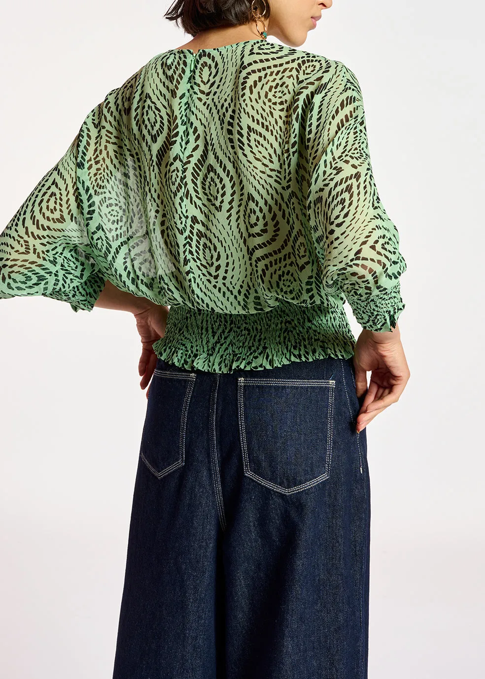Mint green smocked top with geometric print