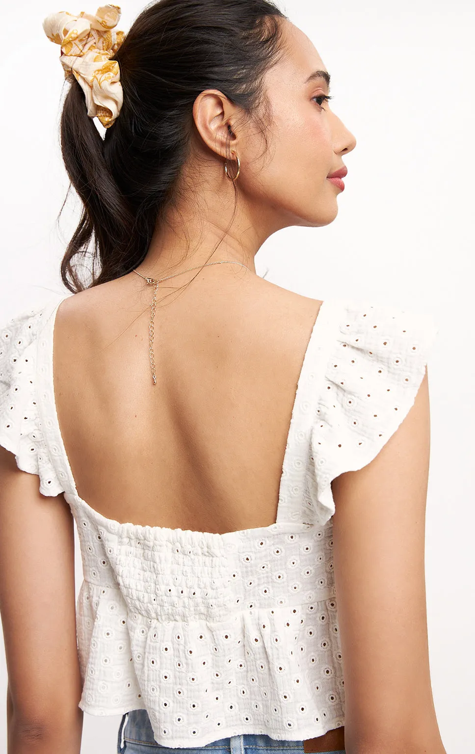 ROMANTIC EYELET KNOTTED TOP WITH RUFFLES